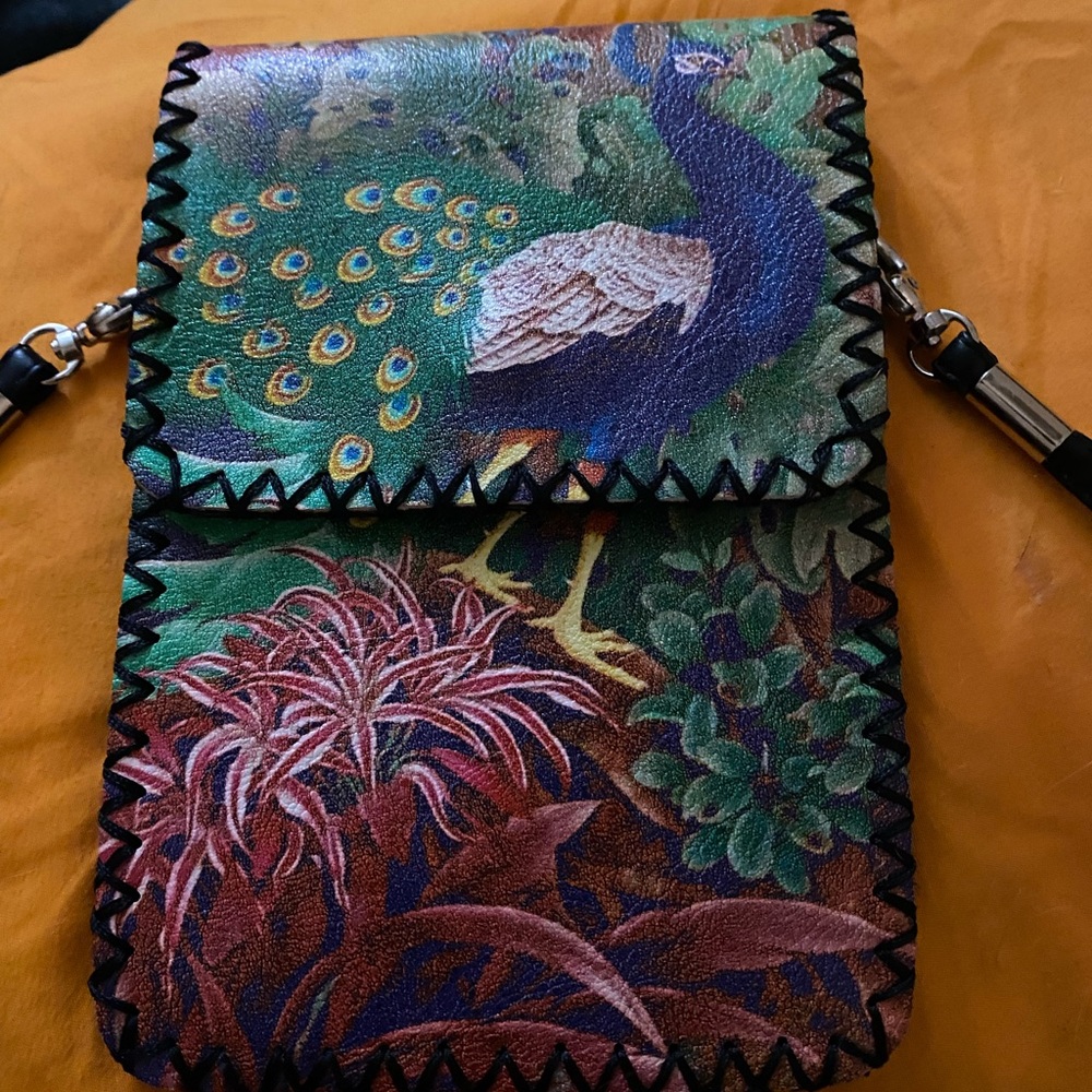 Hand made pleather crossbody with beautiful peacock design.